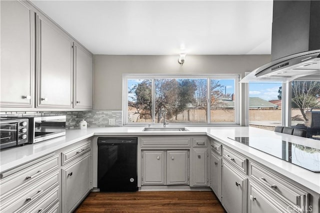 44028 Halcom Ave, Lancaster, CA 93536 - kitchen featuring plenty of natural light, sink, black appliances, and island range hood