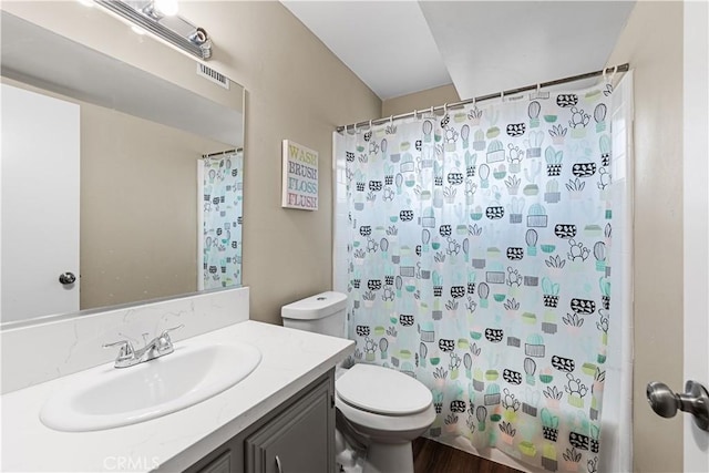 44028 Halcom Ave, Lancaster, CA 93536 - full bathroom featuring wood-type flooring, toilet, vanity, and shower / bathtub combination with curtain