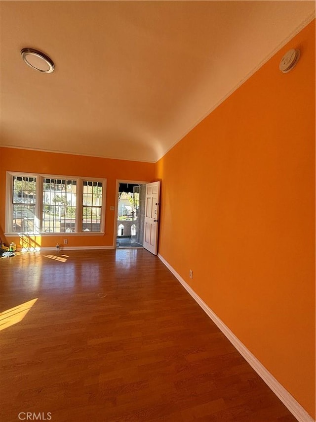 unfurnished room featuring hardwood / wood-style flooring