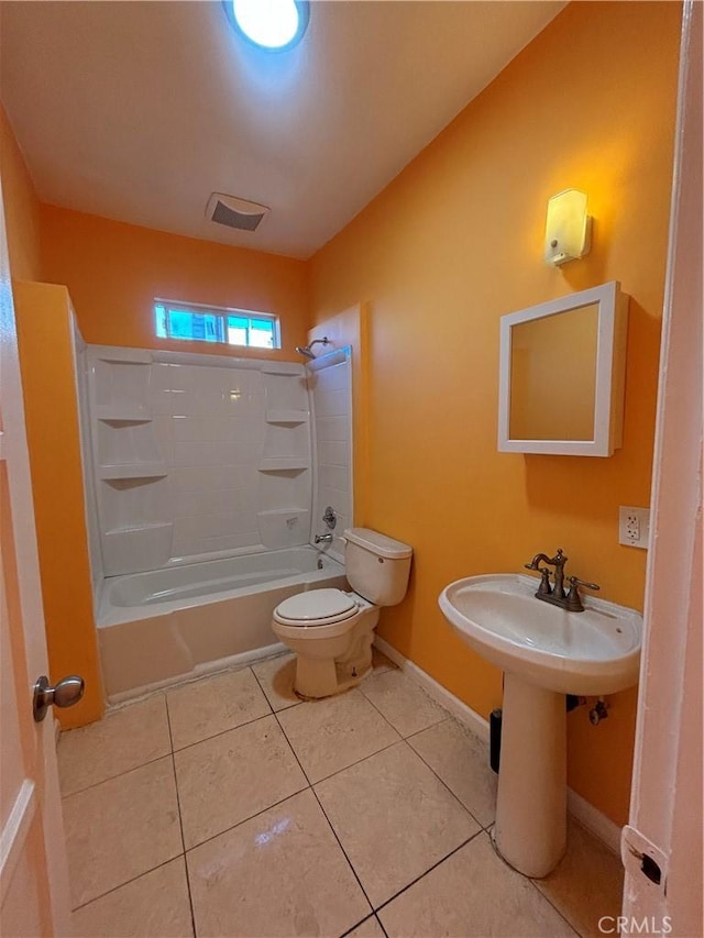 full bathroom featuring toilet, tile patterned flooring, bathing tub / shower combination, and sink