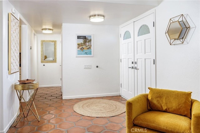 foyer with tile patterned floors