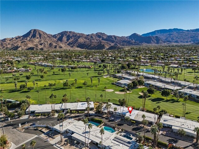 birds eye view of property with a mountain view