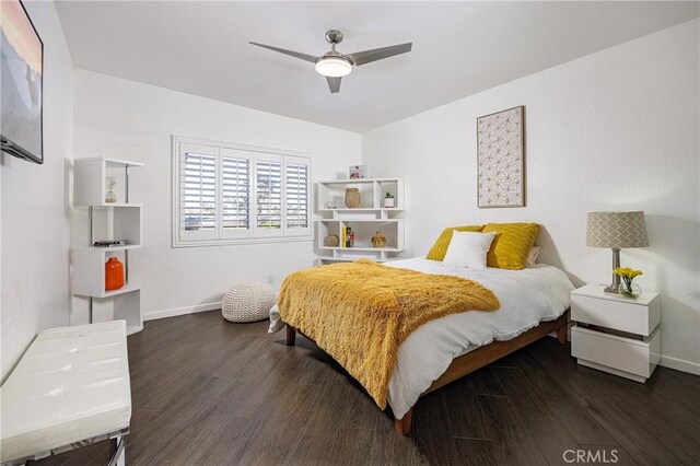 bedroom with ceiling fan and dark hardwood / wood-style floors