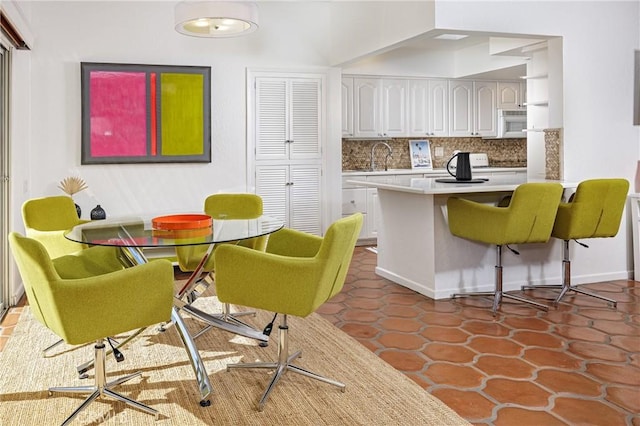 tiled dining space with sink