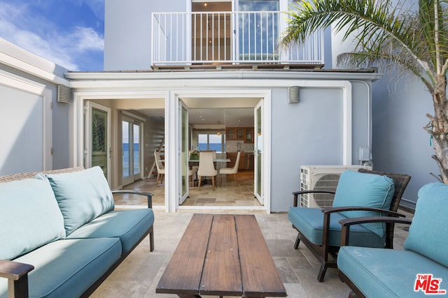 view of patio / terrace with a balcony and outdoor lounge area