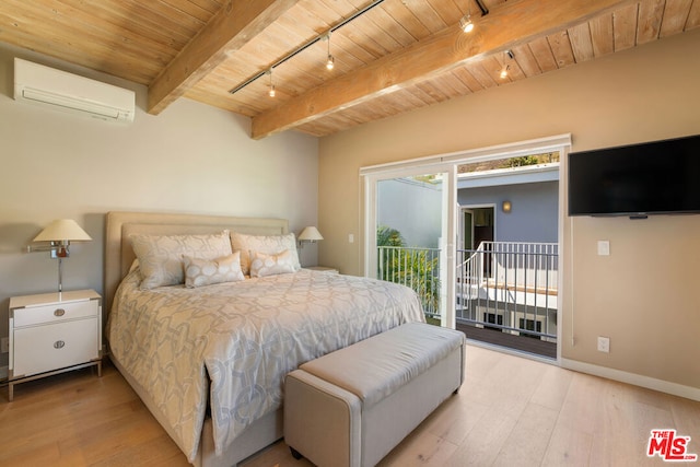 bedroom featuring a wall mounted AC, light hardwood / wood-style floors, access to outside, beamed ceiling, and rail lighting