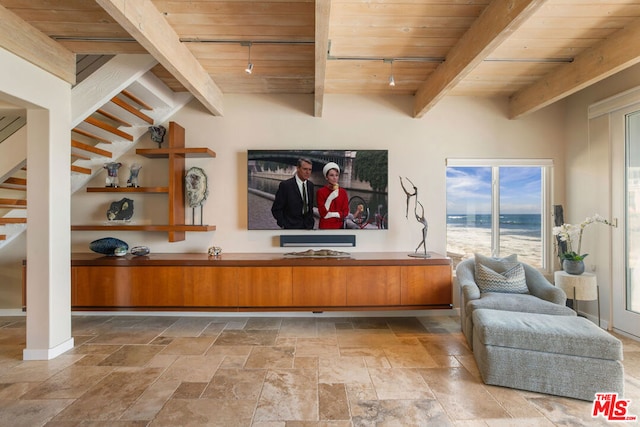 interior space with beam ceiling, wood ceiling, and rail lighting