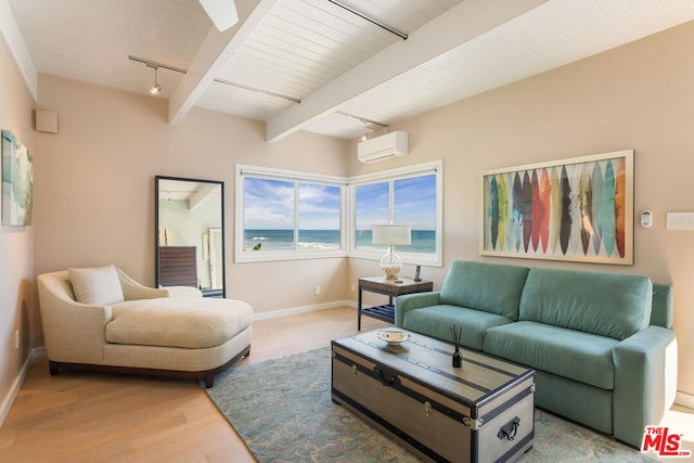 living room featuring beam ceiling, hardwood / wood-style flooring, track lighting, a water view, and wooden ceiling