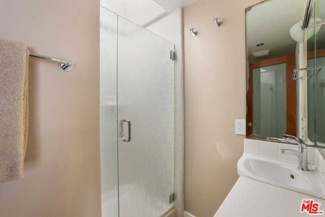 bathroom with sink and walk in shower