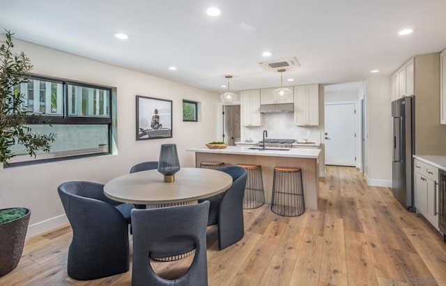 dining area featuring light hardwood / wood-style flooring