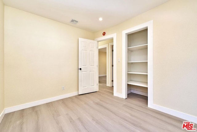 unfurnished bedroom featuring light hardwood / wood-style flooring