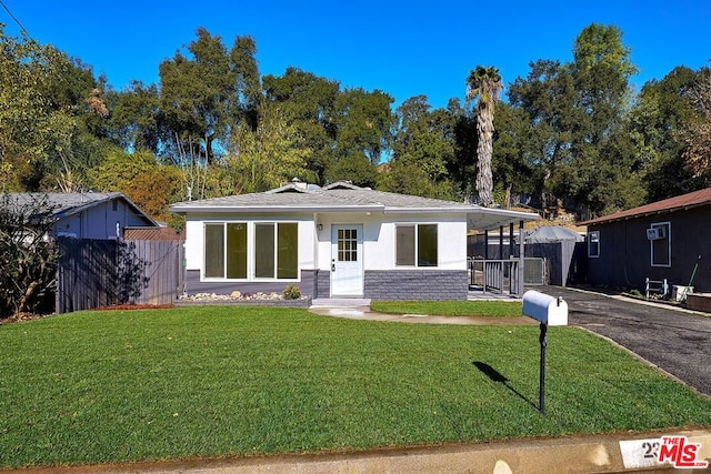 view of front of home with a front yard