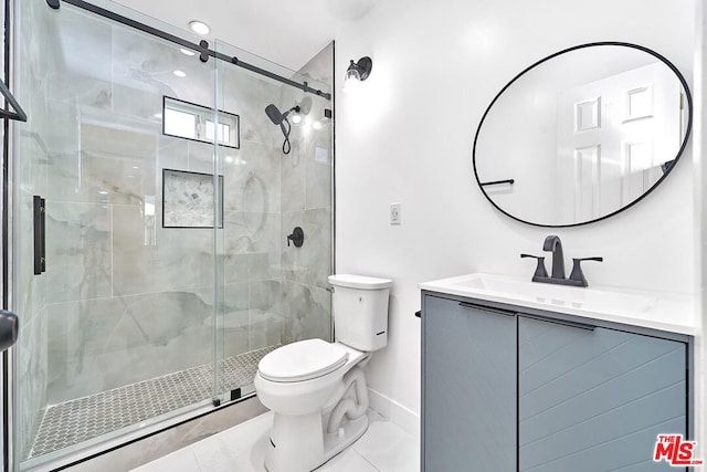 bathroom with toilet, vanity, tile patterned flooring, and an enclosed shower