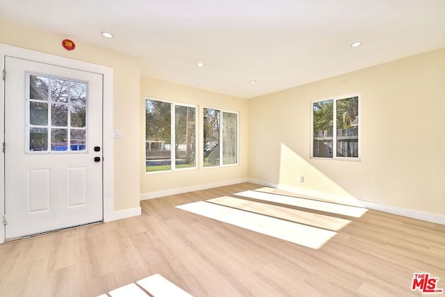 entryway with light hardwood / wood-style floors