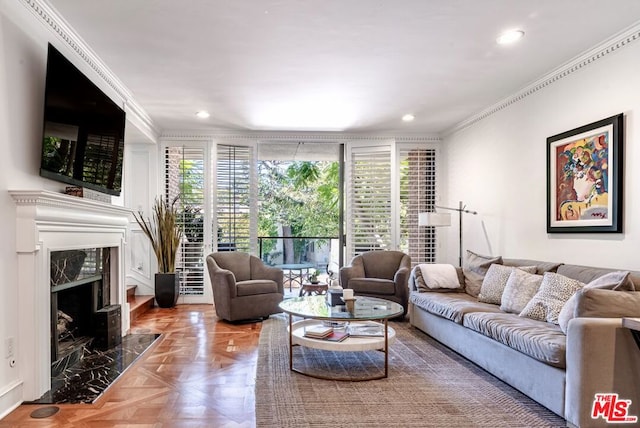 living room with ornamental molding, parquet floors, and a fireplace