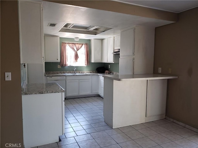 kitchen featuring dishwasher, kitchen peninsula, light tile patterned flooring, sink, and white cabinets