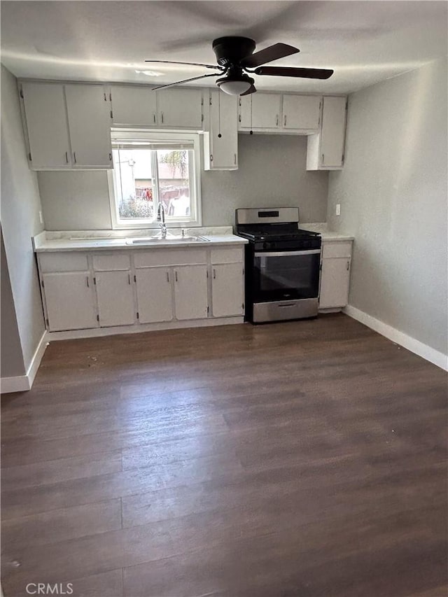 kitchen with sink, white cabinets, and stainless steel gas range