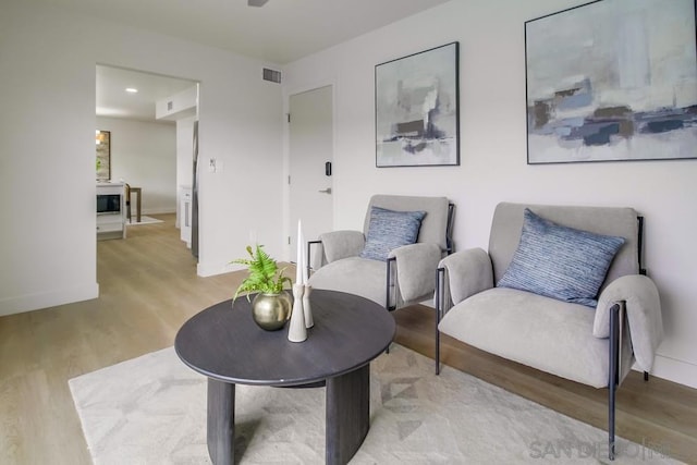 living area featuring light hardwood / wood-style floors