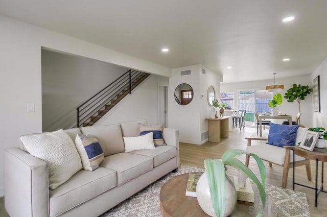 living room with light hardwood / wood-style flooring