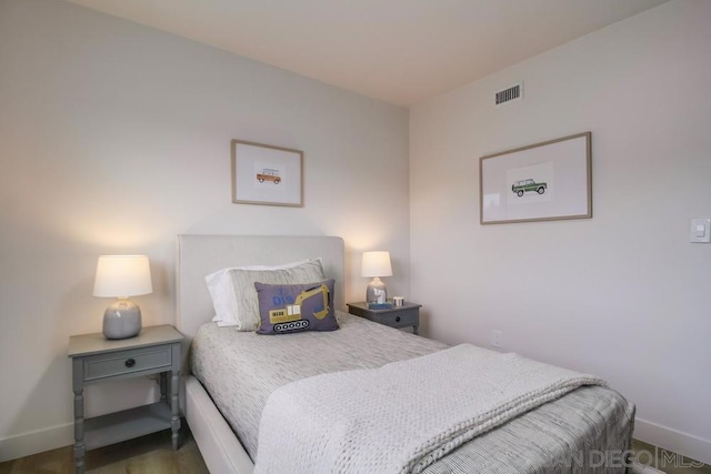 bedroom featuring dark wood-type flooring