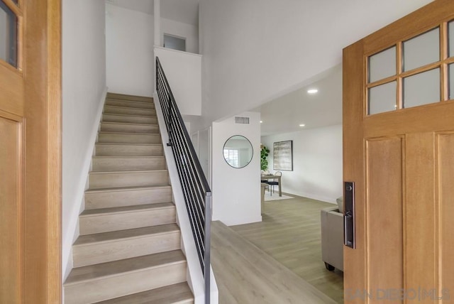 stairway with wood-type flooring