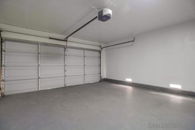 garage featuring a garage door opener