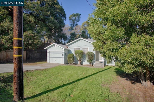 view of front of property with a front lawn and a garage