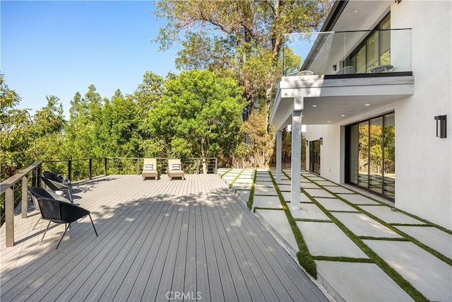 wooden deck with a patio