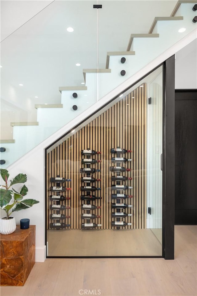 wine room with light hardwood / wood-style floors