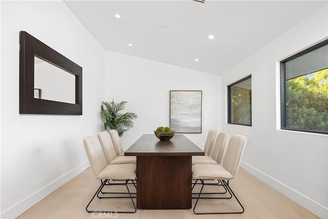 dining room featuring vaulted ceiling