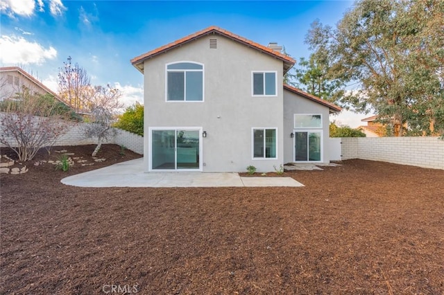 rear view of property with a patio area