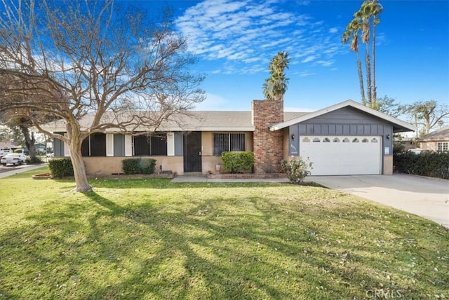 ranch-style home with a front lawn and a garage