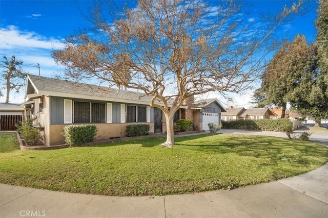 view of front of house featuring a front yard and a garage