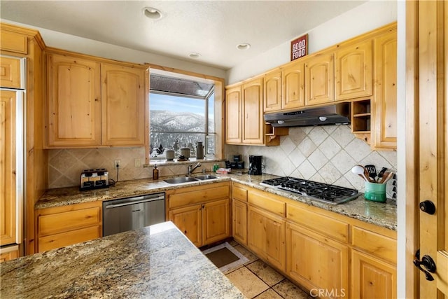 kitchen featuring decorative backsplash, sink, light tile patterned flooring, light stone countertops, and appliances with stainless steel finishes