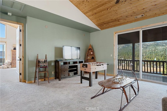 carpeted living room with high vaulted ceiling and wood ceiling