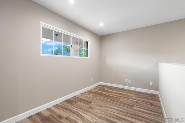 spare room with light wood-type flooring