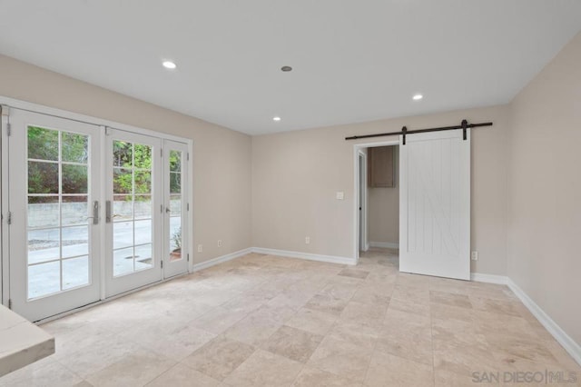 interior space featuring access to outside and a barn door