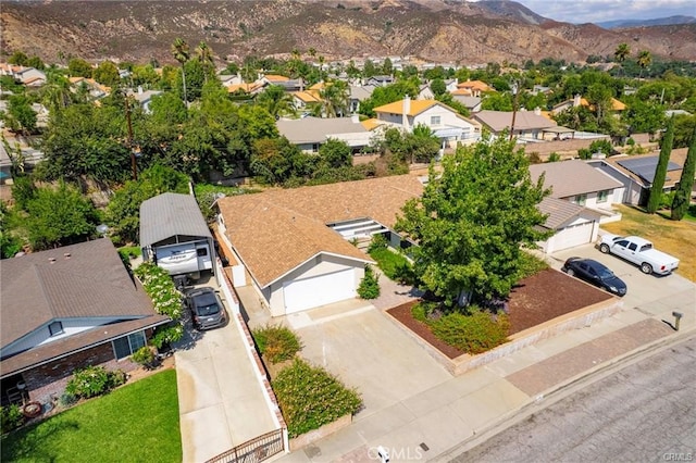 birds eye view of property with a mountain view