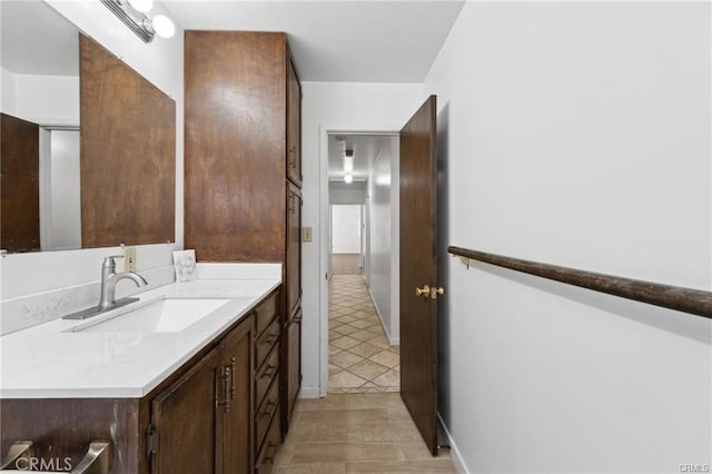 bathroom with tile patterned floors and vanity