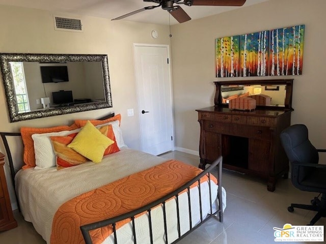 tiled bedroom with ceiling fan