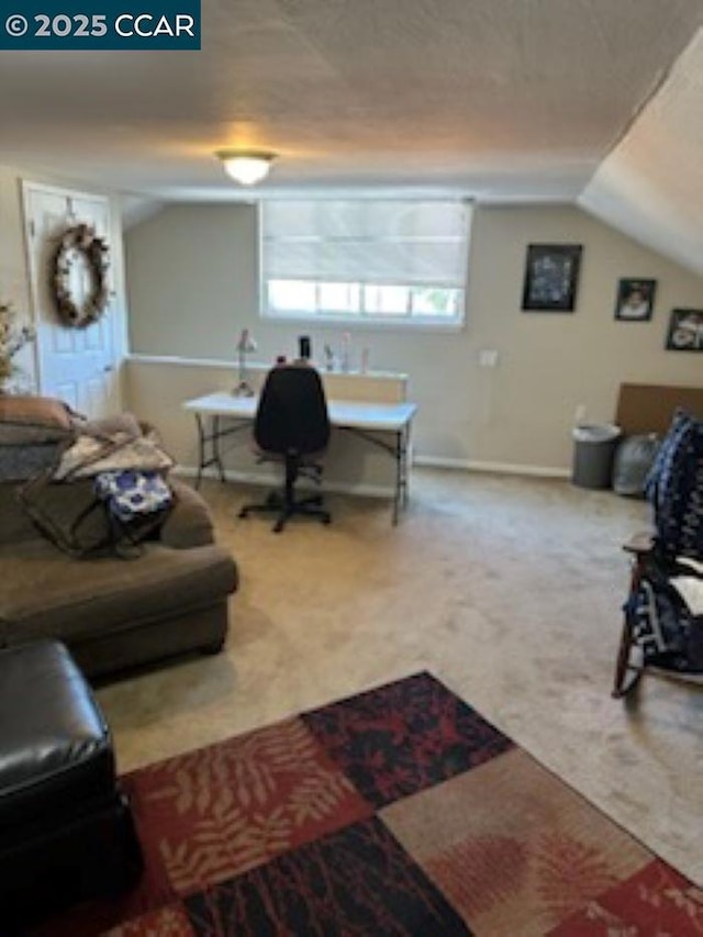 carpeted living room with lofted ceiling