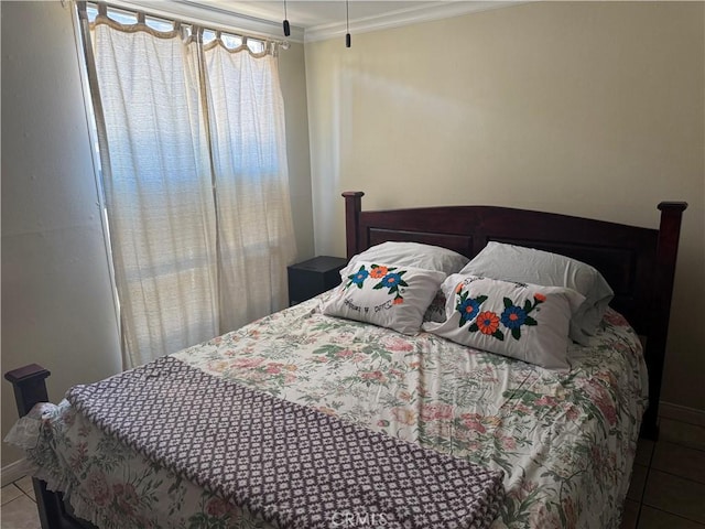 tiled bedroom with ornamental molding