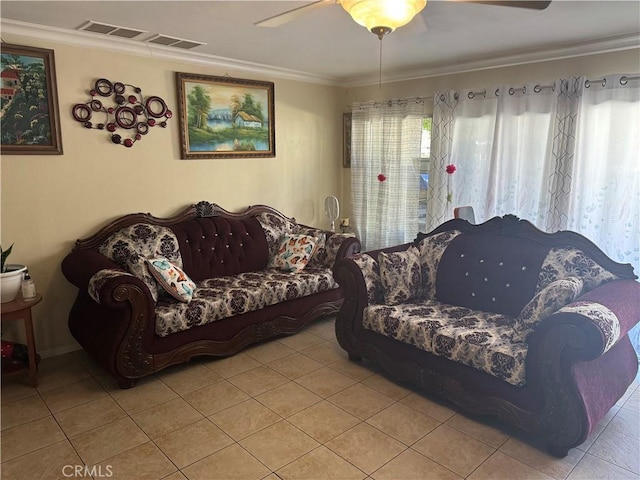 tiled living room featuring ceiling fan and crown molding