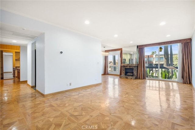 unfurnished living room featuring light parquet floors and crown molding