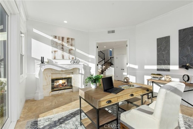 interior space with light tile patterned floors, a premium fireplace, and ornamental molding