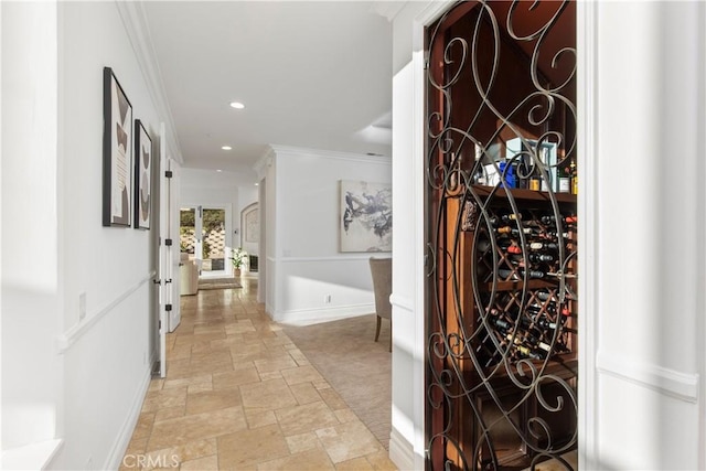 wine room featuring crown molding