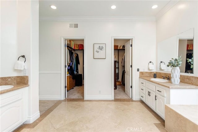 bathroom featuring vanity and ornamental molding