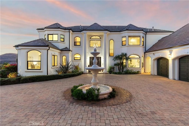 view of front of property with a garage