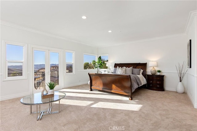 bedroom with ornamental molding and light carpet