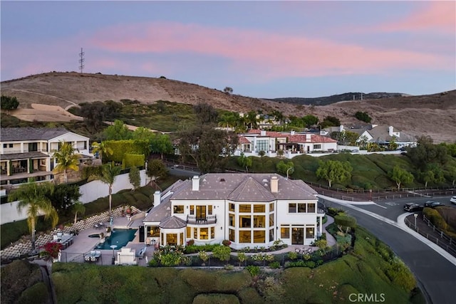 aerial view at dusk with a mountain view